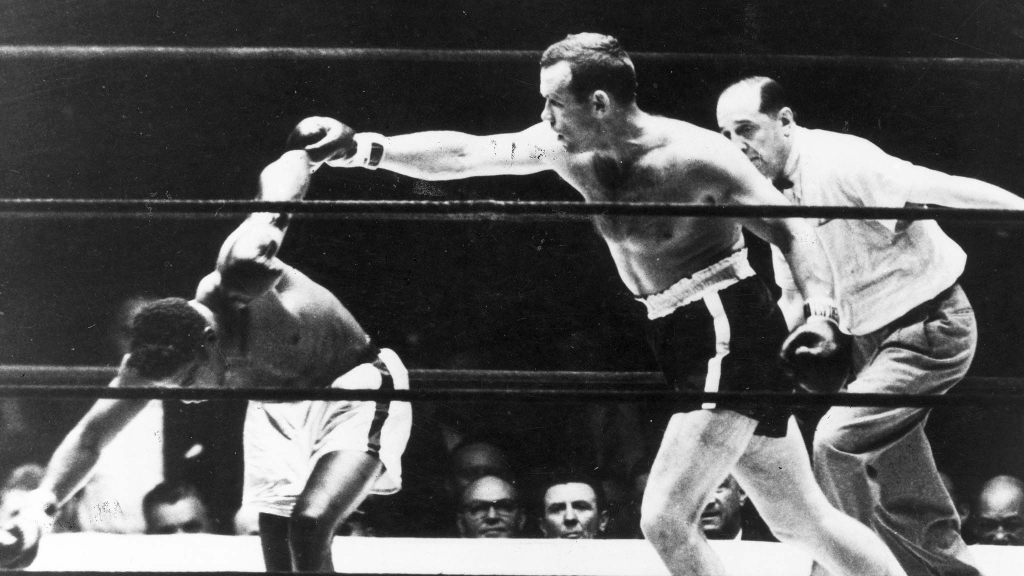 Ingemar Johansson blir världsmästare i tungviktsboxning 1959 i matchen mot Floyd Patterson. Vann på knockout i tredje ronden. Foto: TT/UPI